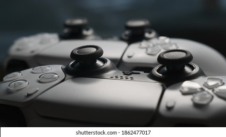 Moscow, Russia - CIRCA 2020: Two Joysticks From Sony PlayStation 5 TV Game Console Spin On Table. Close Up View Of 2 Controllers From New Console