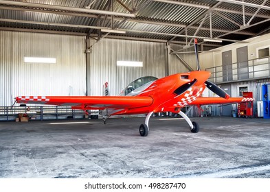 MOSCOW, RUSSIA - CIRCA AUGUST, 2013: Aerobatic Sport Light Prop Plane Extra 330LX Parked In Aircraft Maintenance Hangar