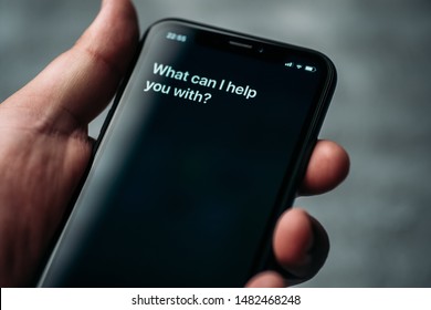 Moscow, Russia - Circa August 2019 : Siri - Apple Voice Digital Assistant Activated By Voice In Male Hand And Text On Iphone Screen: What Can I Help You With? Voice Mode Of Interaction With Smartphone