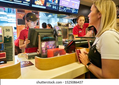 MOSCOW, RUSSIA - CIRCA JANUARY, 2019: Staff Taking An Order From Woman At McDonald's Restaurant In Moscow.