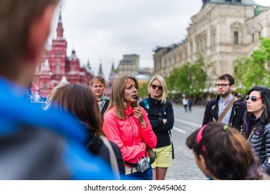 MOSCOW, RUSSIA Circa May 2015: A Girl Working As A Tourist Guide In Moscow On A Walking Tour