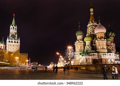 MOSCOW, RUSSIA - DECEMBER 6, 2015: tourists on Vasilevsky Descent of Red Square near Kremlin in Moscow in night. Red Square is the central historical square in Moscow.