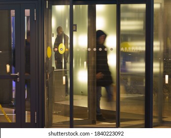 Moscow, Russia - December 9, 2019: Blurred Motion. People Leaving The Office Building. Working Day Had Been Finished. Photography Of Revolving Door Entrance / Exit. Business Concepts And Lifestyles.