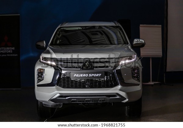 Moscow, Russia - February 17, 2021: All new Mitsubishi
Pajero Sport. Montero. Car stand at the parking box, dark light.
