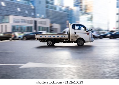 Moscow, Russia - February 2022: Hyundai H-100 Cargo Flatbed Truck In The City Street. Hyundai Porter 2 In Fast Motion With Blurred Background