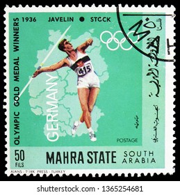 MOSCOW, RUSSIA - FEBRUARY 22, 2019: A Stamp Printed In Saudi Arabia Shows Javelin, Olympic Gold Medal Winners Serie, Circa 1982