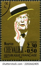 MOSCOW, RUSSIA - FEBRUARY 23, 2022: A Stamp Printed In France Shows Maurice Auguste Chevalier (1888-1972), French Singers, Surcharge Benefited The Red Cross, 1990