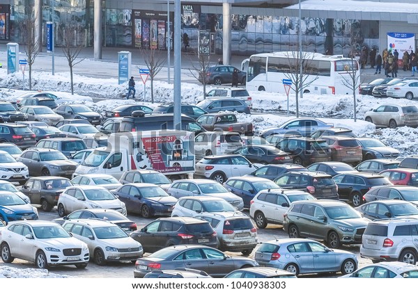 Moscow, Russia - February, 28, 2018: cars on a\
parking in Moscow,\
Russia