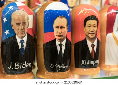 Moscow , Russia - February 28, 2022: Putin, Biden and Xi Jinping in the form of Russian nesting dolls in a gift shop in Moscow. Relations between Russia, USA and China