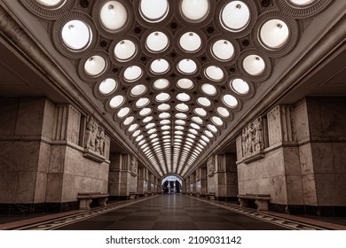 MOSCOW, RUSSIA - Jan 08, 2022: Linear Perspective Symmetrical View Of A Metro Station Elektrozavodskaya With Carved Columns And Straight Rows Of Big Round Lamps On A Ceiling