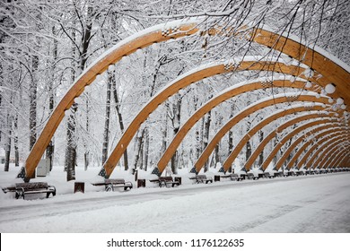 MOSCOW, RUSSIA - JAN 31, 2018: Arches alley in Sokolniki park on winter snowy day. Twenty wooden arches with lamps made after model of 1959.