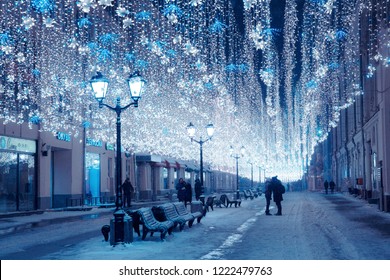 Moscow, Russia, January 17, 2018. Night Winter Moscow In The Snow. Nikolskaya Street Decorated For The New Year. Unidentified People Walking On The Street.