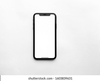Moscow Russia January 2, 2020.  11 iPhone, a modern mobile phone with a blank white screen Isolated on a white background.  top view, flat lay, copy space