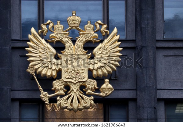 Moscow, Russia - January 2020: Coat of arms\
of Russia closeup, national emblem on the building of Russian\
Parliament. Double headed eagle on State Duma facade, concept of\
government and\
authorities