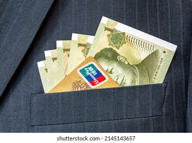 Moscow, Russia - January 21, 2022: Banknotes Of Chinese Currency And Credit Card Union Pay In Business Suit Pocket. Money In The Pocket Of Business Suit