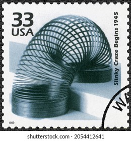 MOSCOW, RUSSIA - JANUARY 26, 2021: A stamp printed in USA shows Slinky Craze Begins, series Celebrate the Century, 1940s, 1999