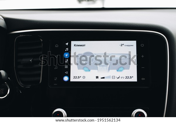 MOSCOW, RUSSIA - JANUARY 30,\
2021 Mitsubishi Outlander dark interior view. Close up view of a\
car media dashboard screen with yandex auto software. Settings\
screen. 