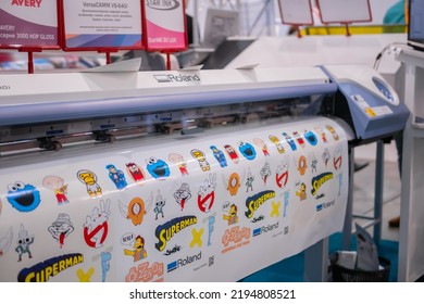 MOSCOW, RUSSIA - JANUARY 5, 2020: Advertising Exhibition. Large Format Colorful Printing - Digital Roland Printer During Work At Printing House, Trade Show