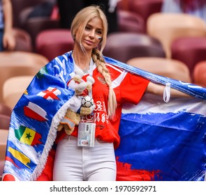 Moscow, Russia - July 1, 2018. Beautiful Russian Lady With Russian Flag And World Cup Mascot Zabivaka Before FIFA World Cup 2018 Round Of 16 Match Spain Vs Russia
