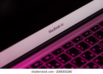 Moscow, Russia. July 13, 2021. Mac Book Air Close-up In Purple Lighting. 