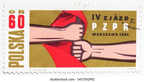 MOSCOW, RUSSIA - JULY 15, 2019: Postage Stamp Printed In Poland Shows Hands Holding Red Flag, 4th Congress Of The Polish United Workers Party Serie, Circa 1964