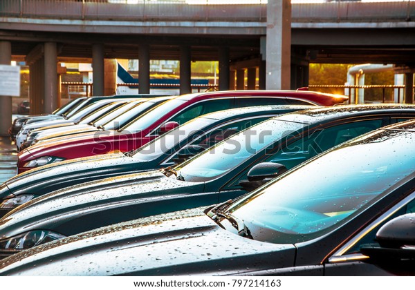 MOSCOW, RUSSIA\
- JULY 17, 2017: luxury Cars For Sale Stock Lot Row. Car Dealer\
Inventory. Cars For Sale Stock Lot Row. Car Dealer Inventory.\
sunset sun rays light. sun\
beam