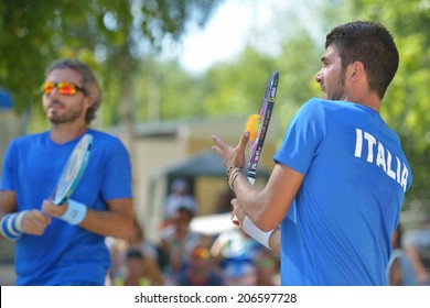 MOSCOW, RUSSIA - JULY 20, 2014: Marco Garavini (center) and Alessandro Calbucci of Italy in the final match against Brazil during ITF Beach Tennis World Team Championship. Italy won 2-0