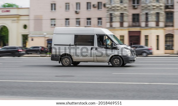 Moscow, Russia - July 2021: Ford Transit Third\
generation in the city street. Side view of white panel van, light\
commercial vehicle