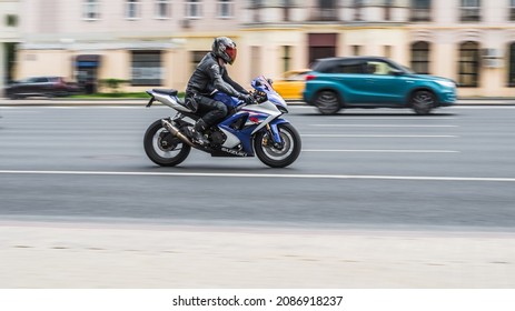 Moscow, Russia - July 2021: Motorcyclist On The Suzuki GSX R750 Motorcycle Driving Fast On The City Street. Exceeding The Speed Limit Is Not Allowed