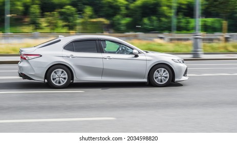 Moscow, Russia - July 2021: Toyota Camry XV70 All New Car Is On The Road In Test Drive. Silver Color Sedan In Motion, Side View