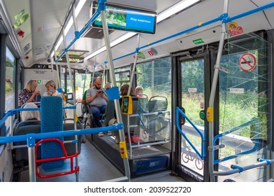 Moscow, Russia - July 22. 2021. Modern bus interior with contactless payment terminal and a monitor
