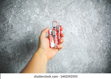 MOSCOW, RUSSIA - JULY 5, 2019: Closeup Of Kinder Chocolate Candy Made By Ferrero SpA On Gray And White Background.