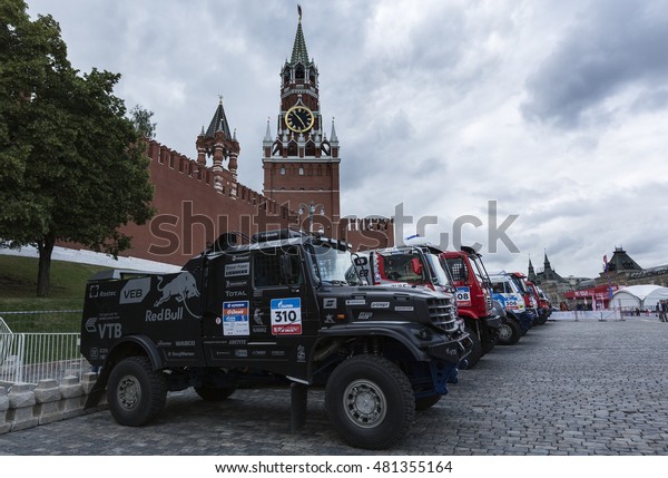 MOSCOW, RUSSIA - JULY 7, 2016: Sports\
cars and trucks awaiting the start of the Silk way rally\
Moscow-Beijing Dakar series on the Red Square near the\
Kremlin
