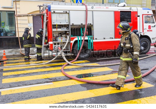 MOSCOW, RUSSIA -\
JUNE 14, 2019: Fire in Moscow on Prechistenka street in the city\
center during the day, firefighters, emergency workers and police\
work at the scene of an\
emergency