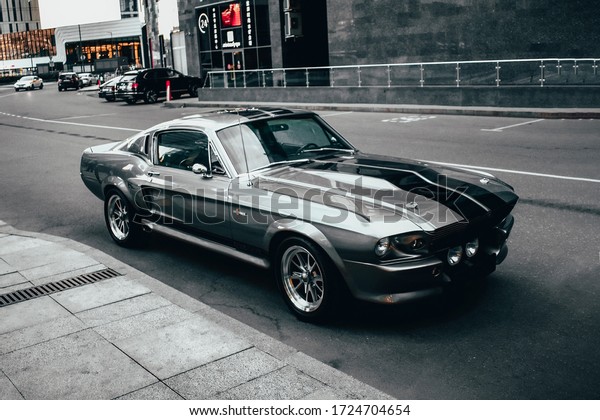 Moscow, Russia, June\
15, 2019: Ford Mustang Shelby GT500 Eleanor stands in the business\
district of Moscow City