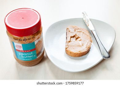 MOSCOW, RUSSIA - JUNE 16, 2020: Above View Of Jar Of Hy-Top Creamy Peanut Butter And Toast With Spread On Plate On Table. HyTop Is Brand Of Private Label Groceries Created In The 1950 In Illinois, USA