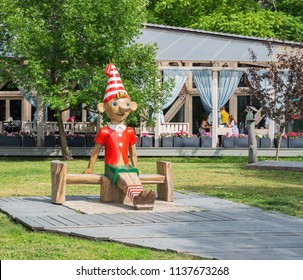 MOSCOW, RUSSIA - June 19, 2018: Wooden Sculpture Of Buratino (Russian Pinocchio)in The Park