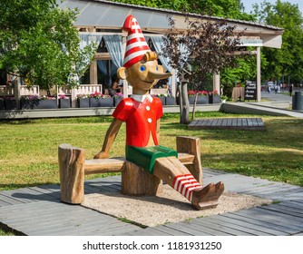 MOSCOW, RUSSIA - June 19, 2018: Wooden Sculpture Of Buratino (Russian Pinocchio)in The Park