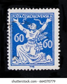 MOSCOW, RUSSIA - JUNE 20, 2017: A Stamp Printed In Czechoslovakia Shows Woman Breaking Chains To Freedom, Circa 1920