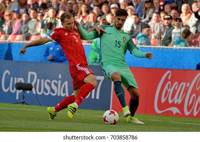 MOSCOW, RUSSIA - JUNE 21, 2017. Russian Defender Roman Shishkin And Portuguese Midfielder Andre Gomes In FIFA Confederations Cup Match Russia Vs Portugal.