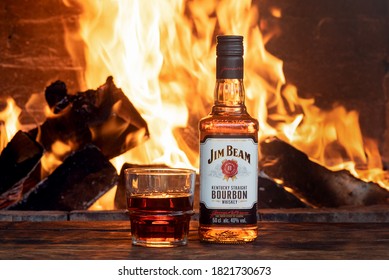 Moscow, Russia - june 30, 2019 : Jim Beam bourbon bottle on the wooden table background.
