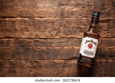 Moscow, Russia - june 30, 2019 : Jim Beam bourbon bottle on the old wooden table background.