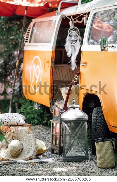 MOSCOW, RUSSIA, - JUNE 7, 2022: Vacation\
in mobile home, picnic near the camper trailer. Summer outdoor.\
Volkswagen Camper Van, bus, van. Selective\
focus