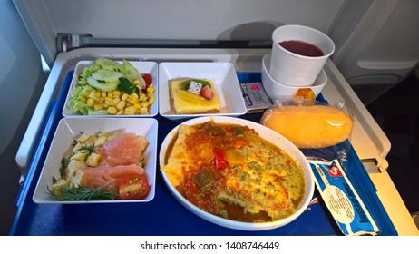 Moscow, Russia - Mar 2019: Food Served On Board Of Premium Economy Class Airplane