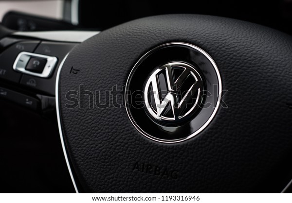 MOSCOW, RUSSIA -\
MARCH 11, 2018 VOLKSWAGEN PASSAT Wagon interior view. Family wagon\
car. Volkswagen close up logo on steering wheel. Volkswagen car\
logo bage. VW plate\
logo.
