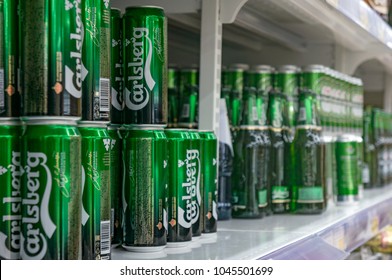 Moscow, Russia - March 12, 2018: Display with Carlsberg beer in cans in supermarket Lenta. One of largest retailer in Russia