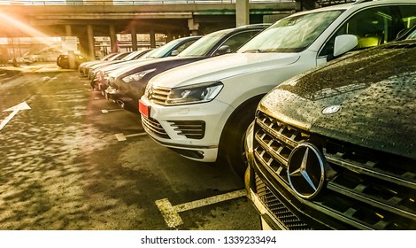 MOSCOW, RUSSIA - MARCH 12, 2019: Luxury Cars For Sale Stock Lot Row. Car Dealer Inventory. Cars For Sale Stock Lot Row. Car Dealer Inventory. Sunset Sun Rays Light. Sun Beam