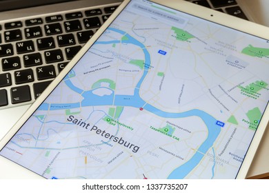 Moscow / Russia - March 13, 2019: The White IPad Lies On The MacBook Keyboard. On The Screen Is A Map Of The City Of St. Petersburg