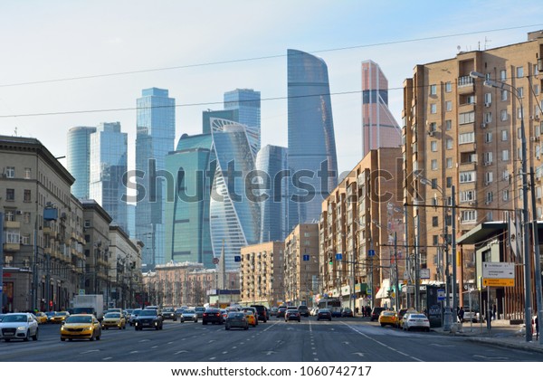 Moscow, Russia - March 17, 2018. Street view on\
Bolshaya Dorogomilovskaya street in Moscow, with skyscrapers of\
Moscow City, residential buildings, commercial properties, street\
traffic and people.