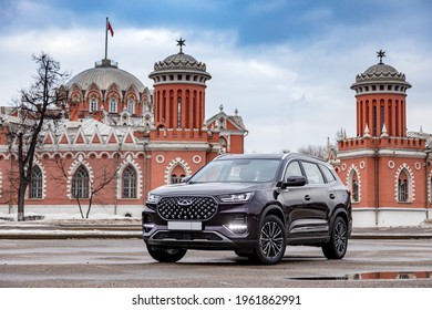 Moscow, Russia - March 19, 2021: Chery Tiggo 8 Pro \ Plus The Car Is Parked On The Street Of A Big City. Megapolis. The SUV Is Purple. Large Car From China. Front And Three-quarter Views.
